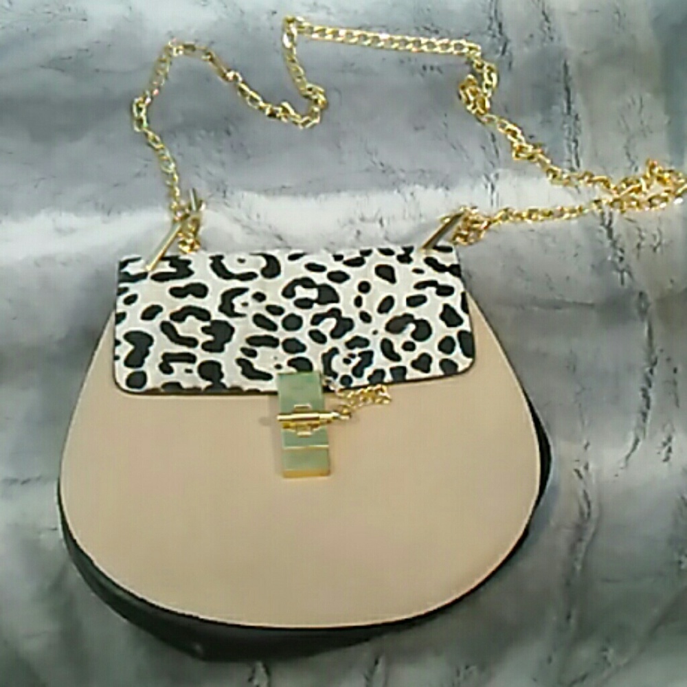 Dalmation print snow leopard twist lock crossbody